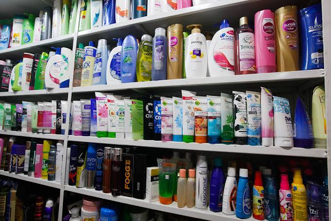 Real cosmetics shelves with hair care, skincare, and beauty products